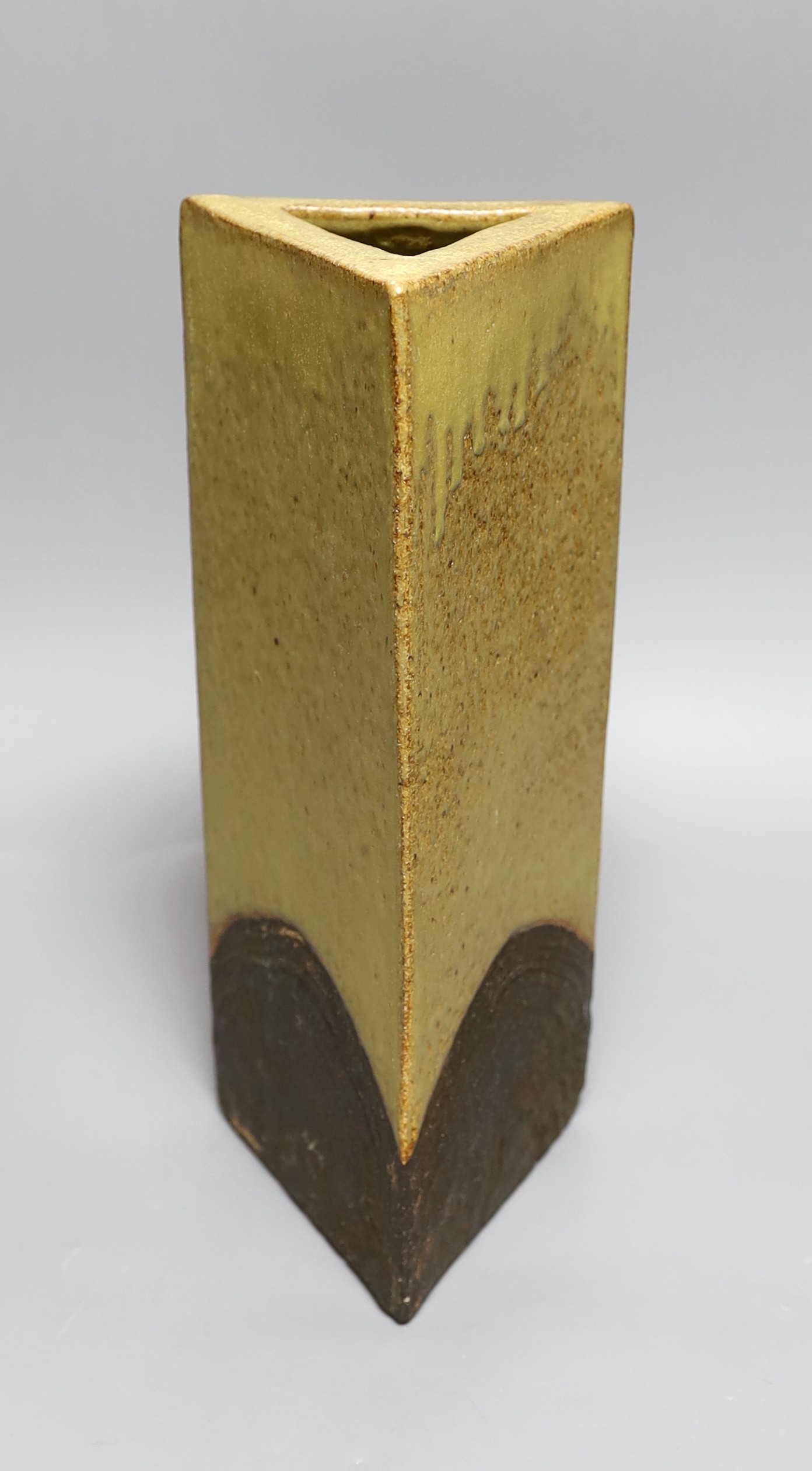 A glazed pottery triangular vase, inscribed Troika England 33cms high